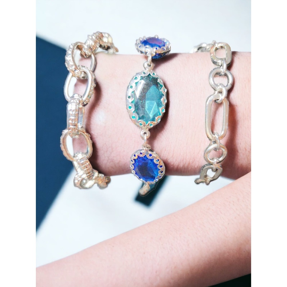 3 individual silver tone with blue and teal bracelets